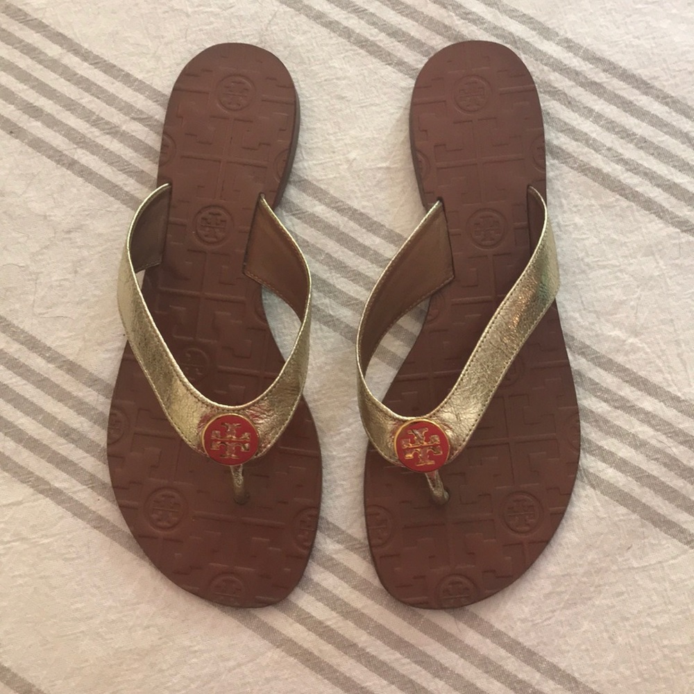 Tory Burch gold flip flops